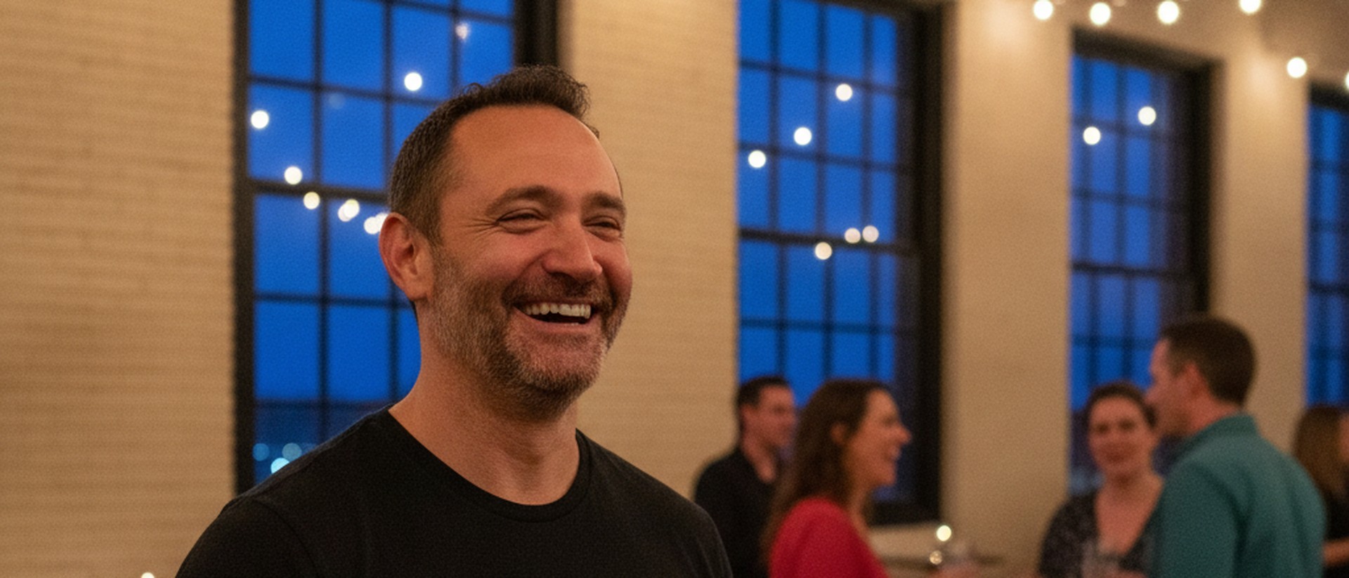 Nat laughing with members at an evening BeBetter meetup